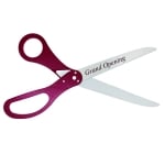 Image of ceremonial scissors with custom logo sample and maroon handles.